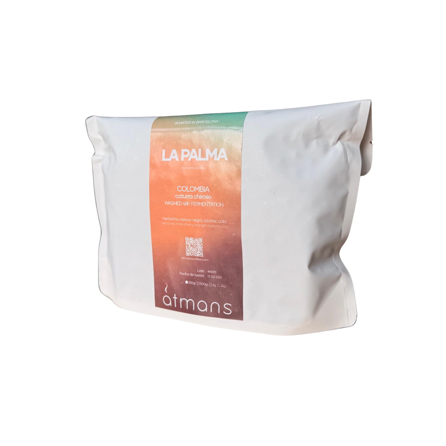A white paper pouch of étans La Palma Colombia coffee, featuring a vertical label with a green-to-orange gradient and white text, set against a plain white background.